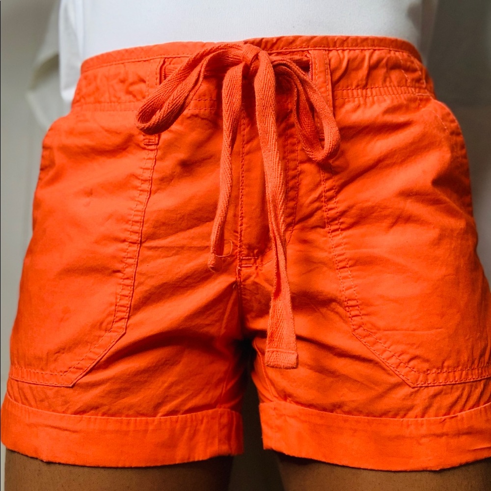 Bright orange "cargo style" shorts.